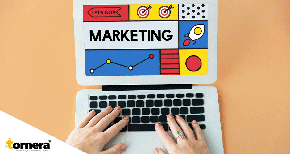 Tela de computador com a palavra "Marketing" em design colorido, simbolizando estratégias visuais digitais