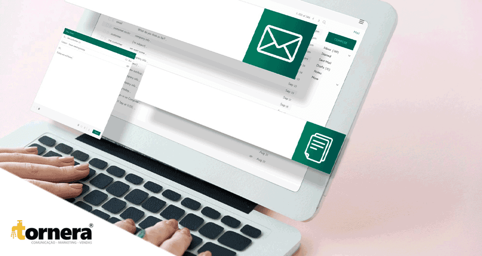 Uma pessoa digitando em um laptop com uma caixa de e-mail verde na tela